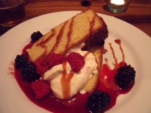 Almond cake with berries and mascarpone caramel sauce 